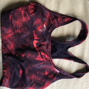 A comfy red and purple Nike sports bra.